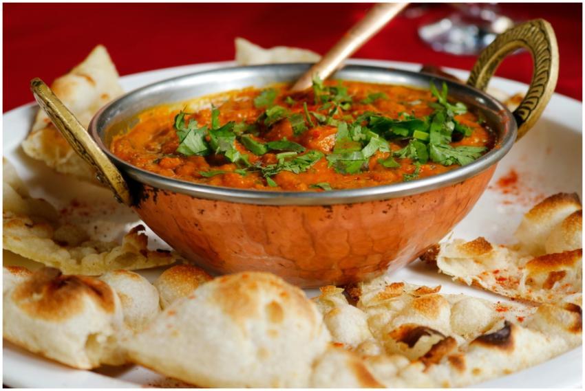 Delicious Indian curry garnished with cilantro ser