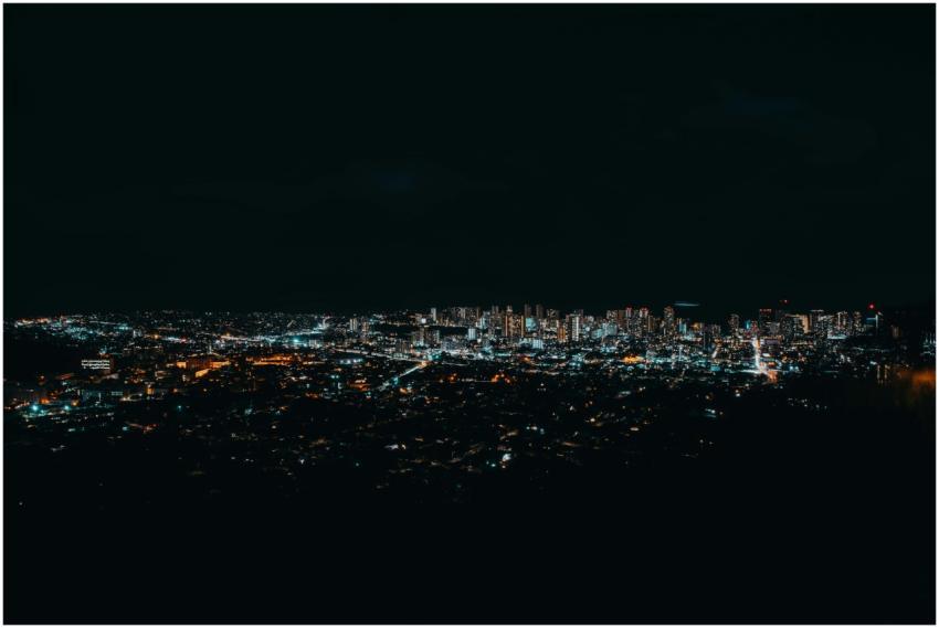 A breathtaking aerial view of a city skyline glowi