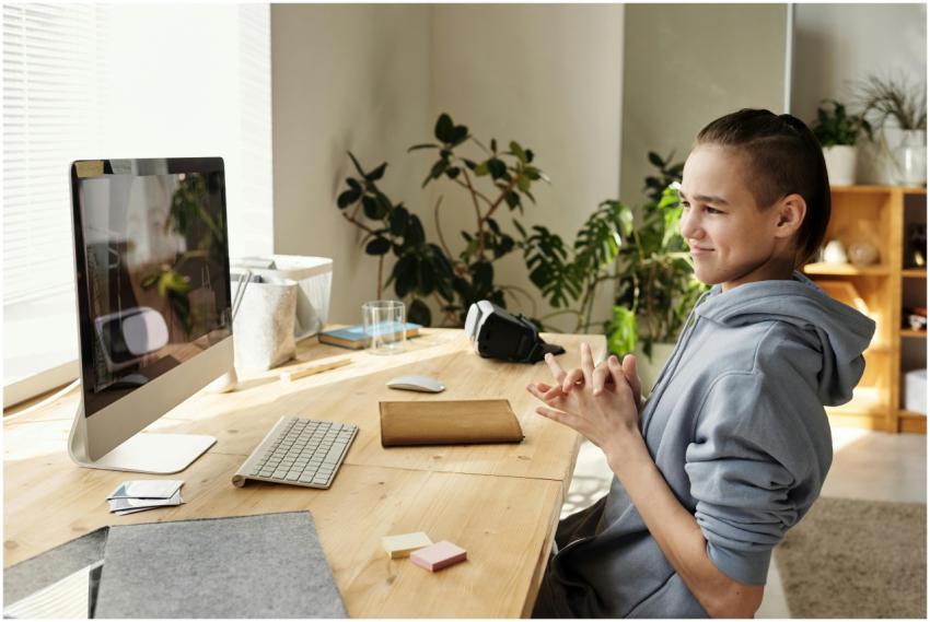 Teenager enjoying a study session with a computer
