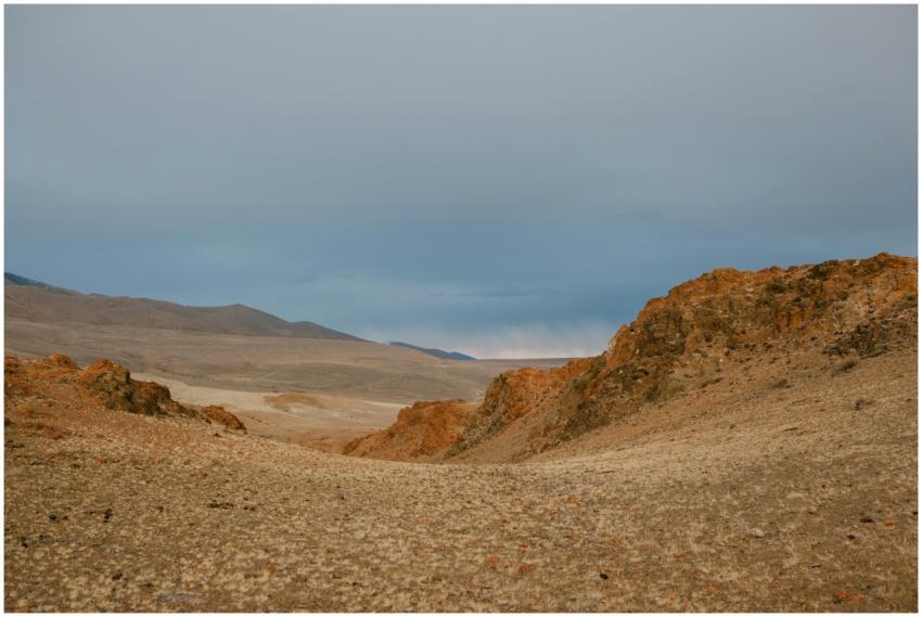 Expansive view of a desert landscape with rocky te