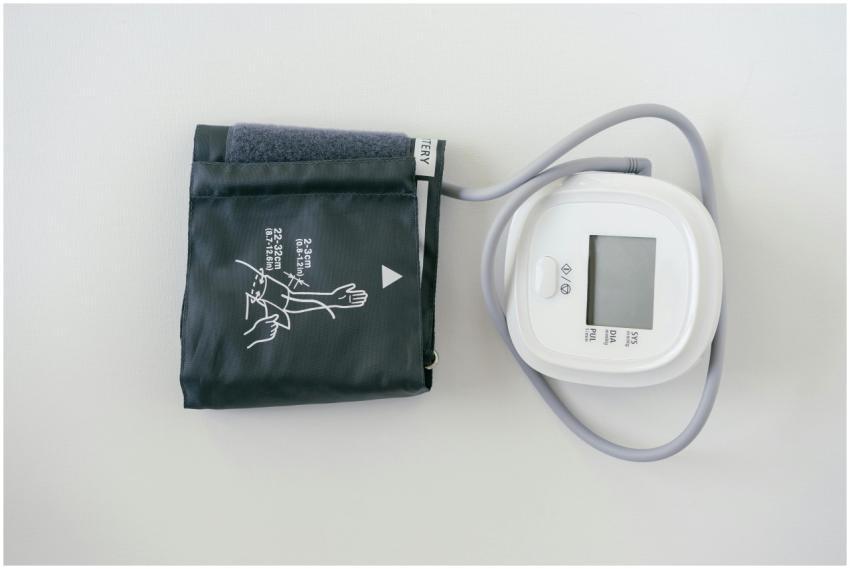 A digital sphygmomanometer on a white background,