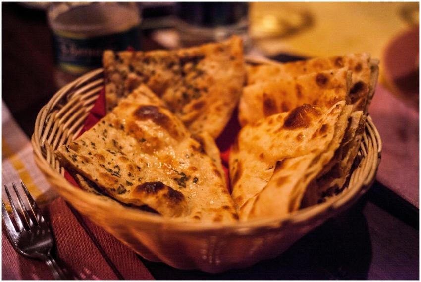 Close-up of traditional Indian flatbreads in a bas