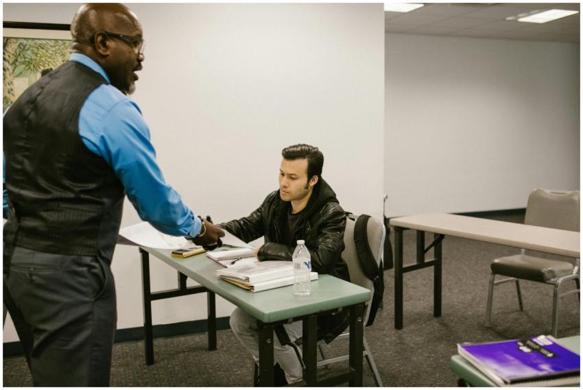 Instructor interacting with a student in a college