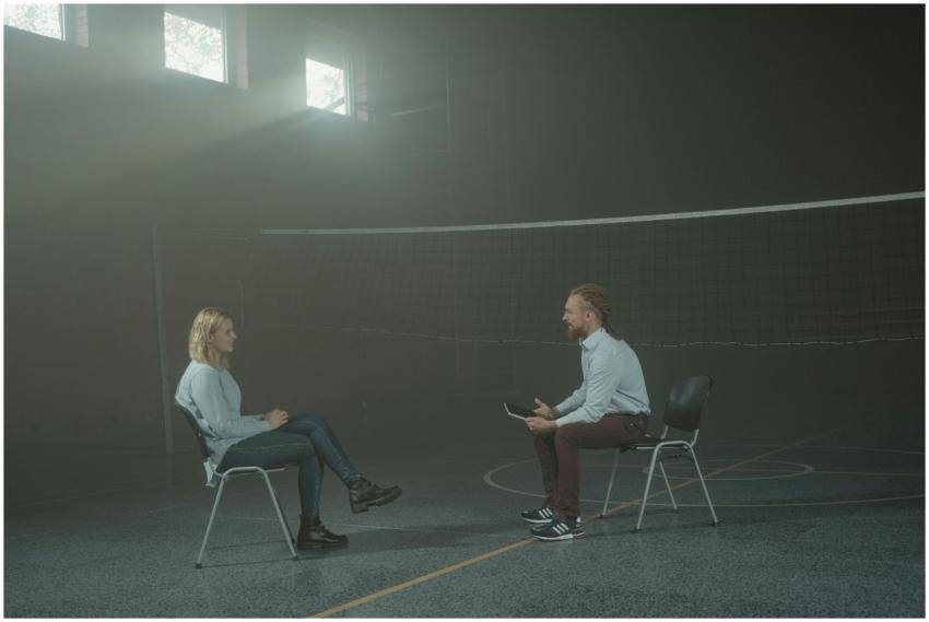 A man and a woman engage in a therapy session in a