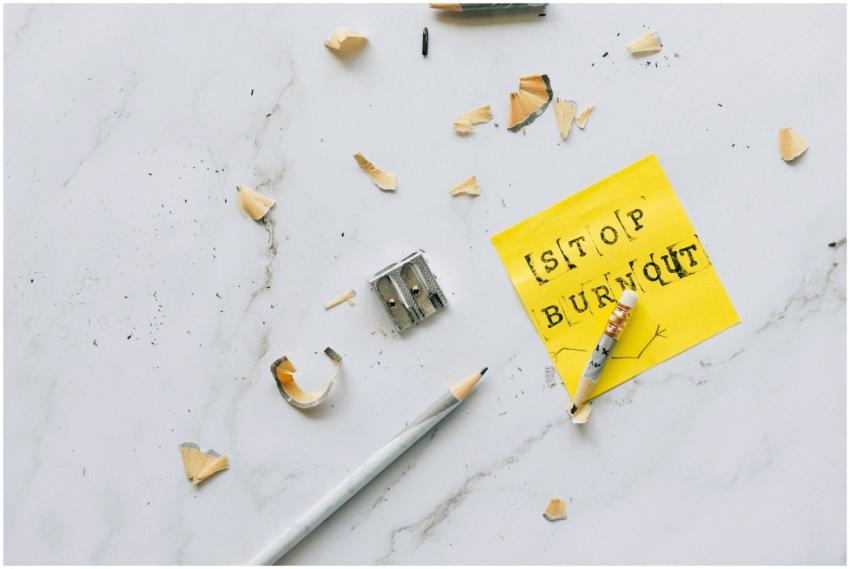 Overhead shot of a note saying 'Stop Burnout' on a