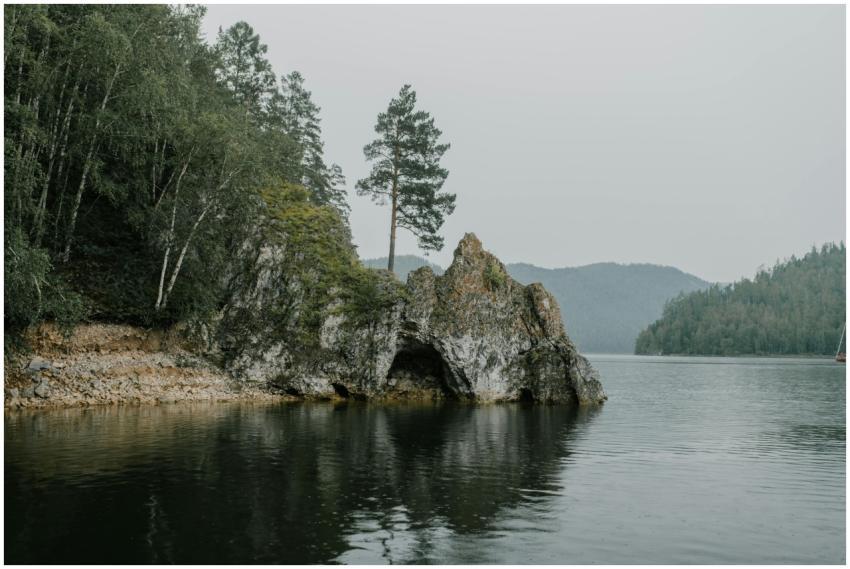 Serene landscape featuring rocky formations and tr