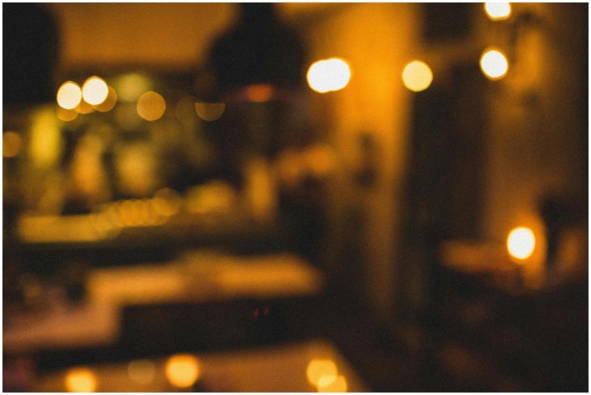 Defocused interior of restaurant illuminated with