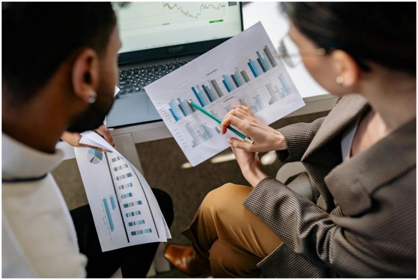 Colleagues collaborating on data charts and discus