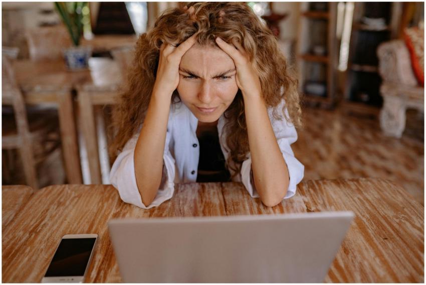 Stressed woman at home struggling with remote work