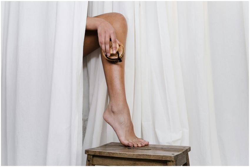 A close-up of a person using a dry brush for eco-f