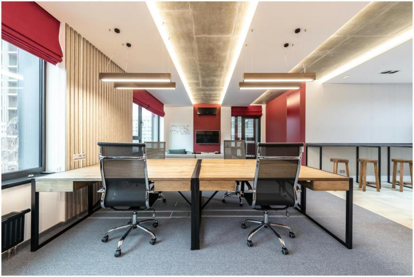 Spacious contemporary office with wooden desks and