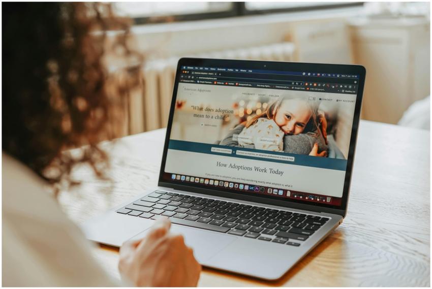 A woman researching adoption information on a lapt
