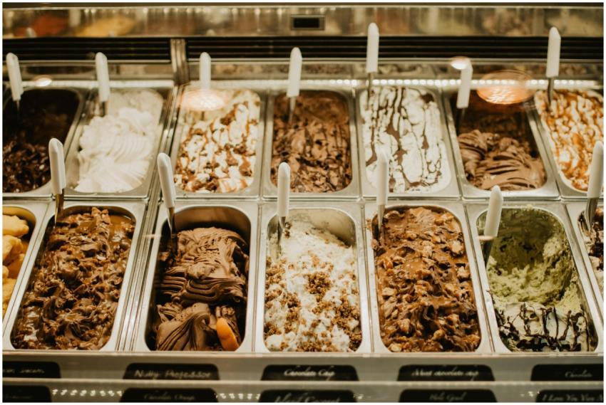 A close-up view of various gelato flavors in trays