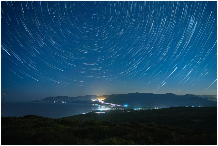 Long exposure of star trails over mountains and co
