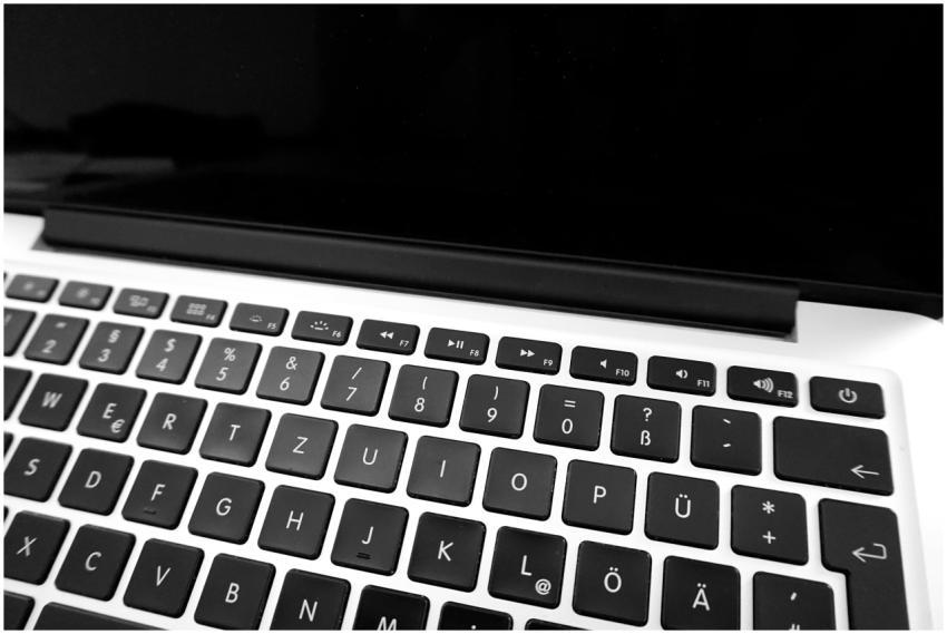 Monochrome image of a laptop keyboard showing Germ