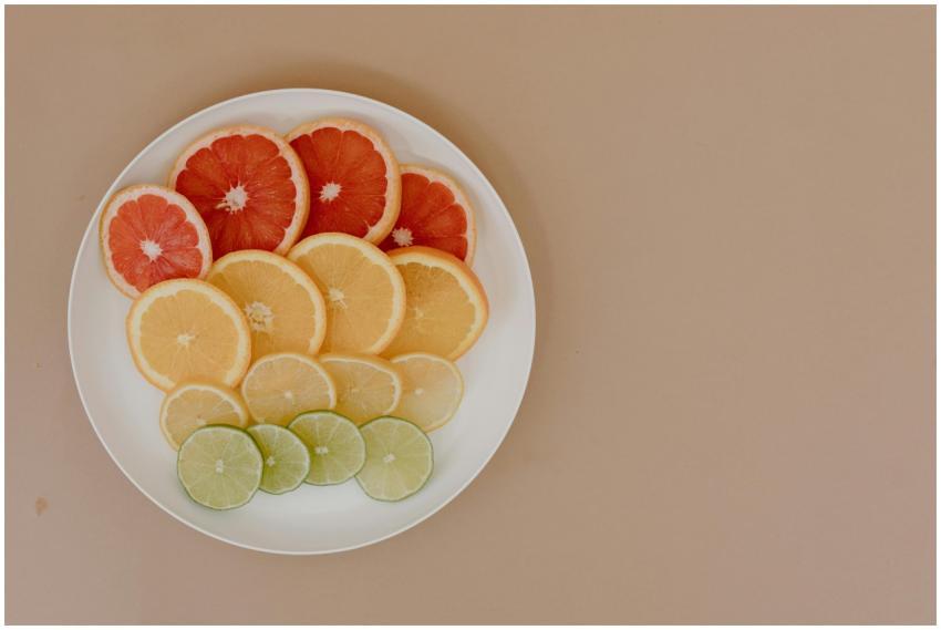 Variety of sliced citrus fruits arranged on a plat