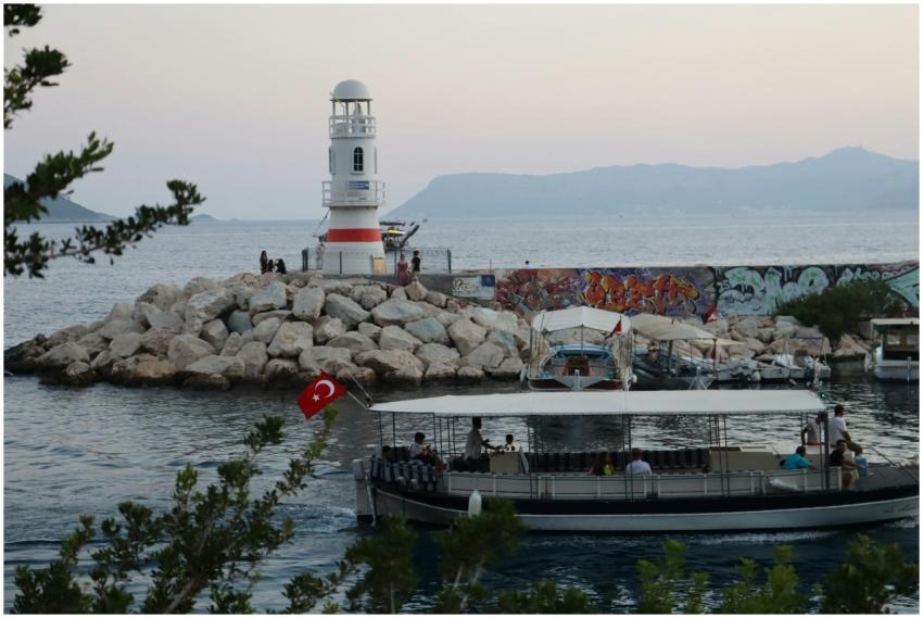 Scenic view of a lighthouse and boat with Turkish