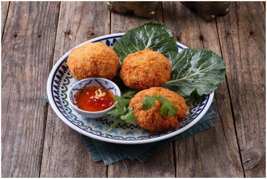Crispy golden croquettes served with sweet chili s
