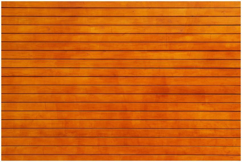 Close-up of a vibrant orange wooden wall texture,