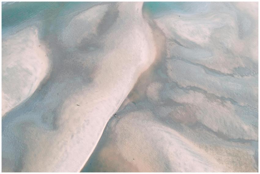 A tranquil aerial view showing flowing sand patter