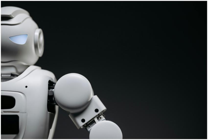 Close-up of a modern, monochrome robot arm against