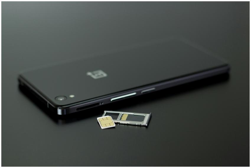 Close-up of a smartphone with a SIM card and memor