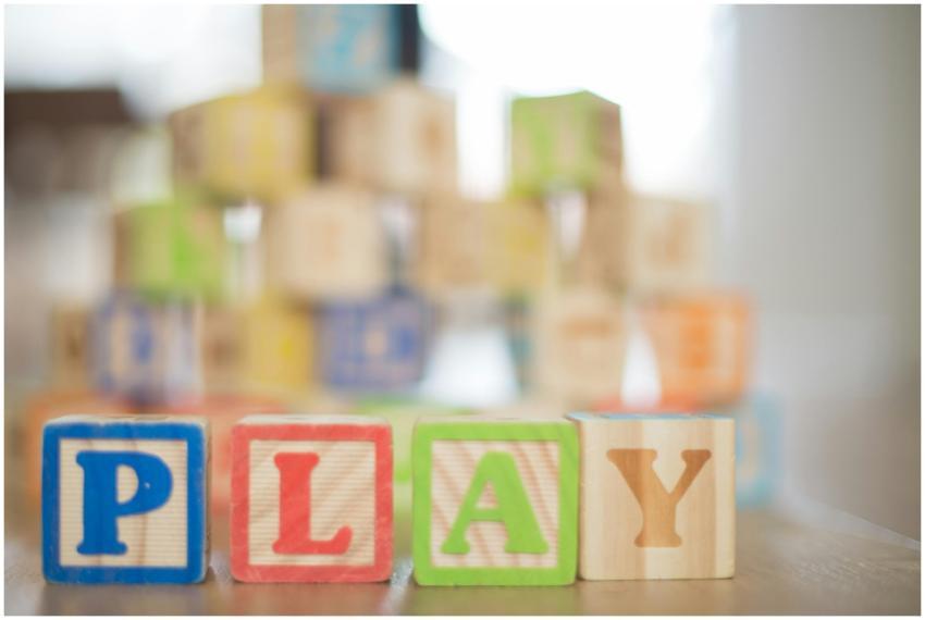 Close-up of colorful wooden blocks spelling 'PLAY'