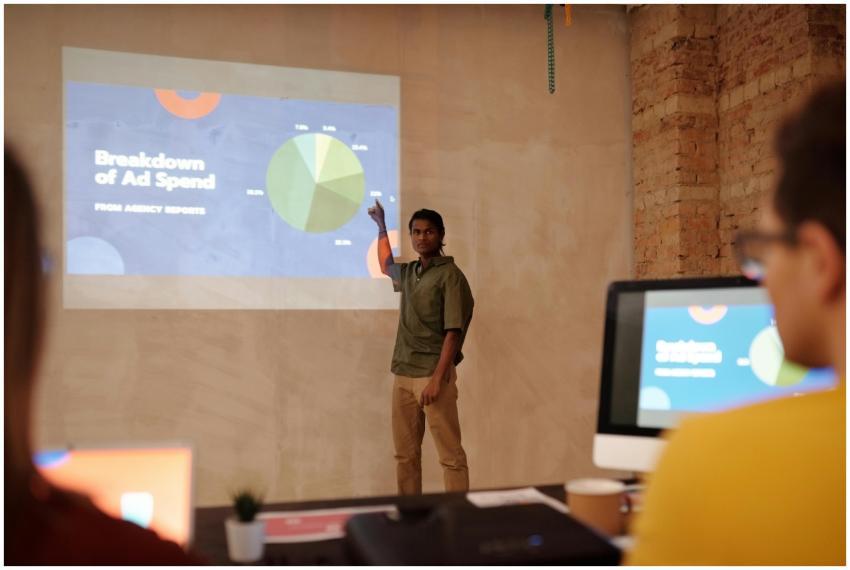 Young man delivering a business presentation on ad