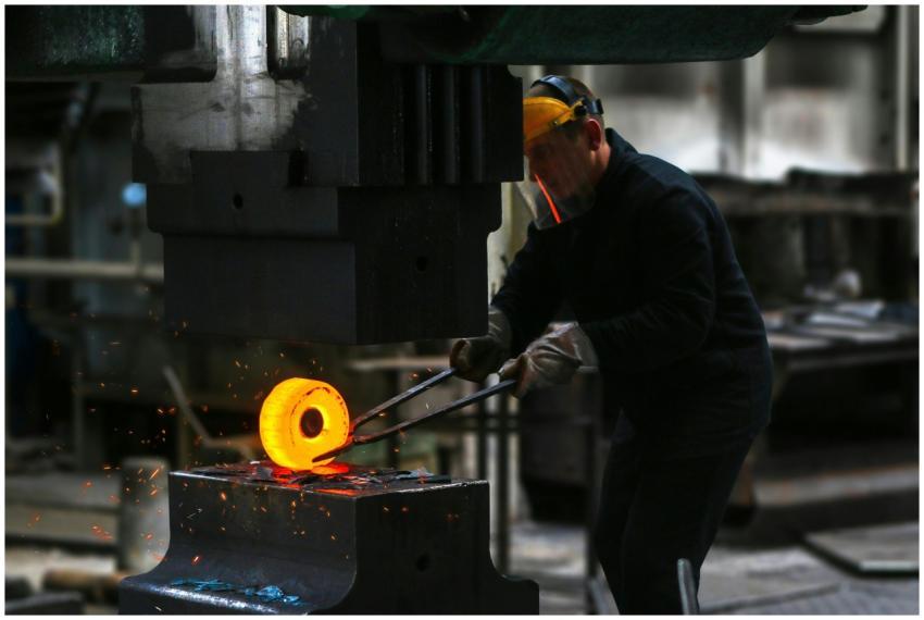 A blacksmith skillfully working with red-hot metal