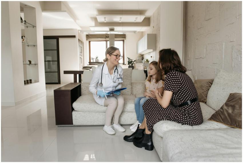 A mother and daughter receive a consultation from