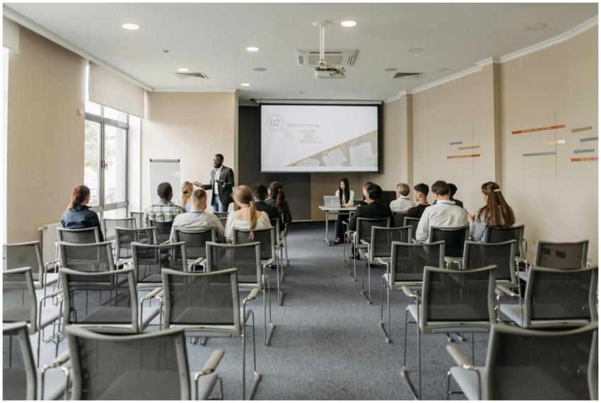 A group attending a business presentation in a mod