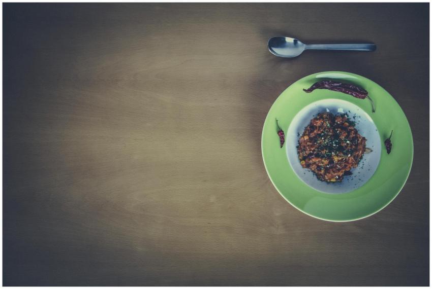 Overhead view of a flavorful spicy dish garnished