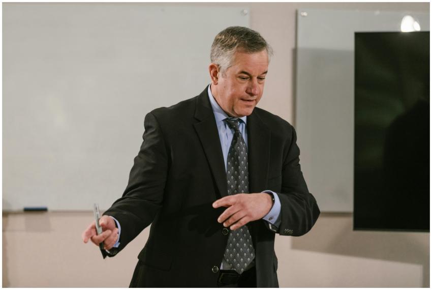 A business professional leading a presentation in