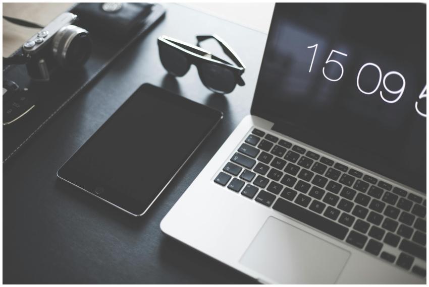 A flat lay of a modern workspace featuring a lapto