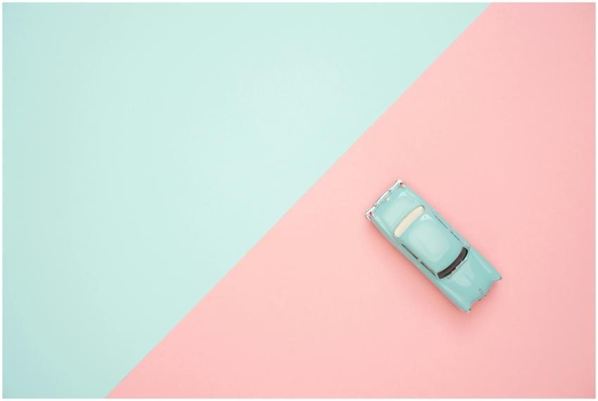 Toy car on a pastel pink and blue background, repr
