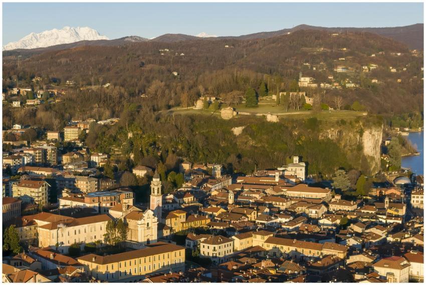 Aerial view of Arona, Italy with mountains in the