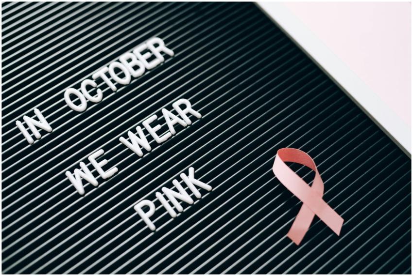 Letter board with 'In October We Wear Pink' messag