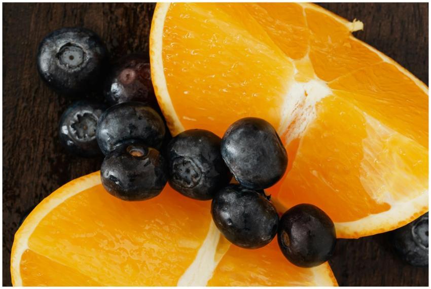 From above organic blueberries scattered on halves