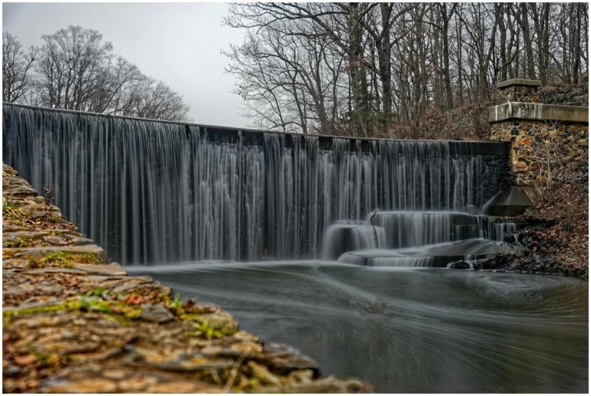 Serene waterfall flowing over stone dam in New Jer