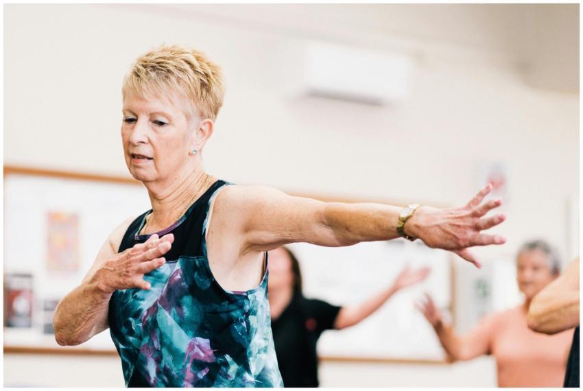 Senior woman participating in a lively fitness cla