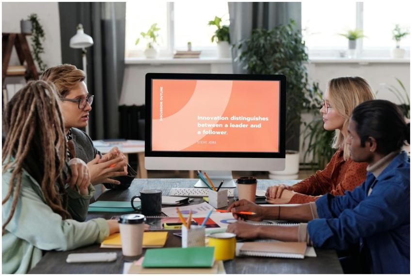 A multicultural team collaborating in an office, d