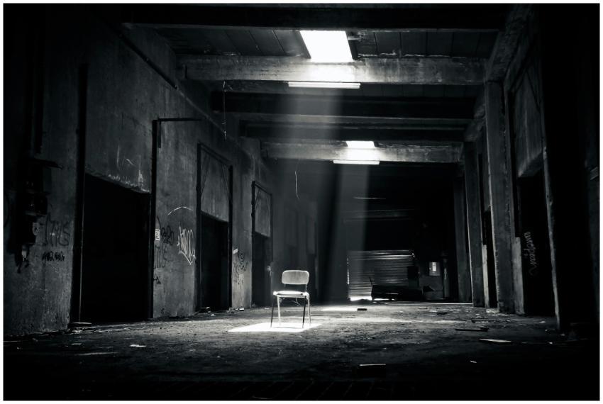 A haunting black and white photo of an abandoned w