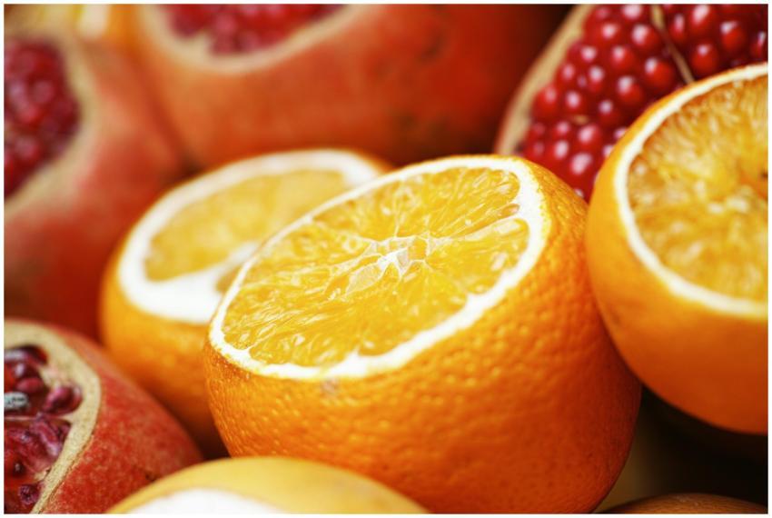 Close-up of sliced oranges and pomegranates showca