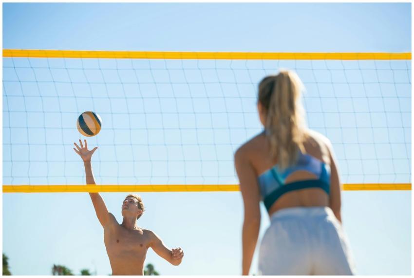 A vibrant game of beach volleyball with two player