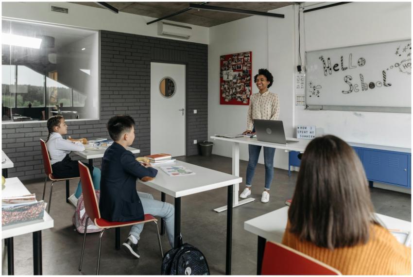 A modern classroom with a teacher and attentive st