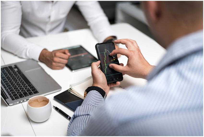 Business professionals using smartphones and table