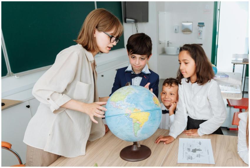 A teacher and three students engaged in a geograph