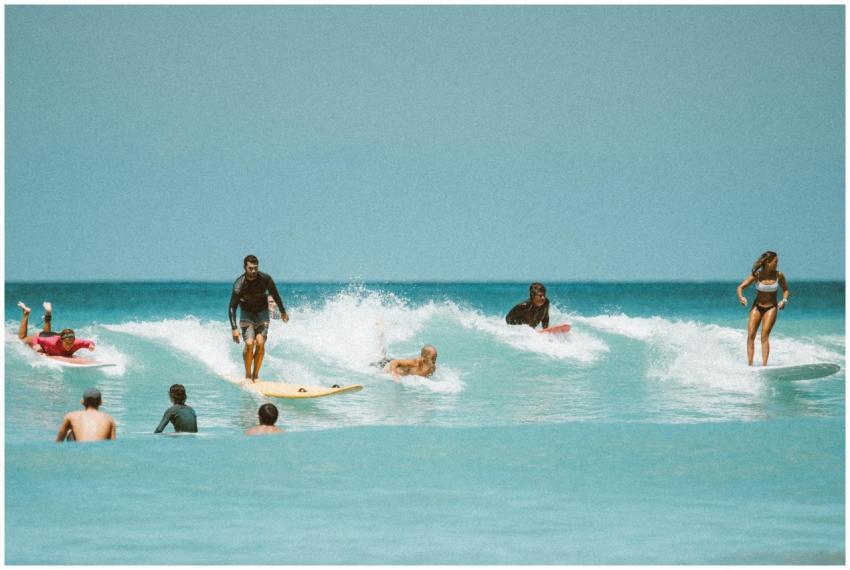 Surfers riding thrilling waves in Honolulu, Hawaii
