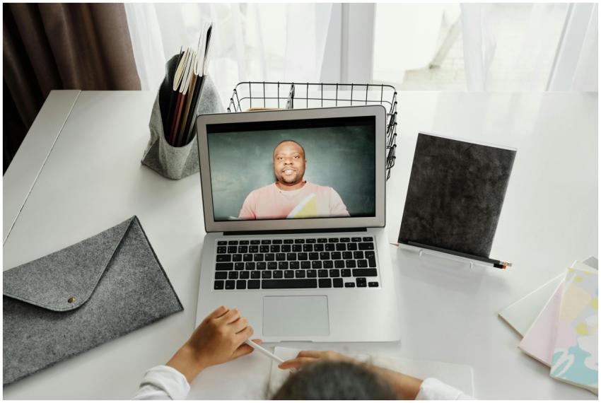 A student participates in a virtual class with a t