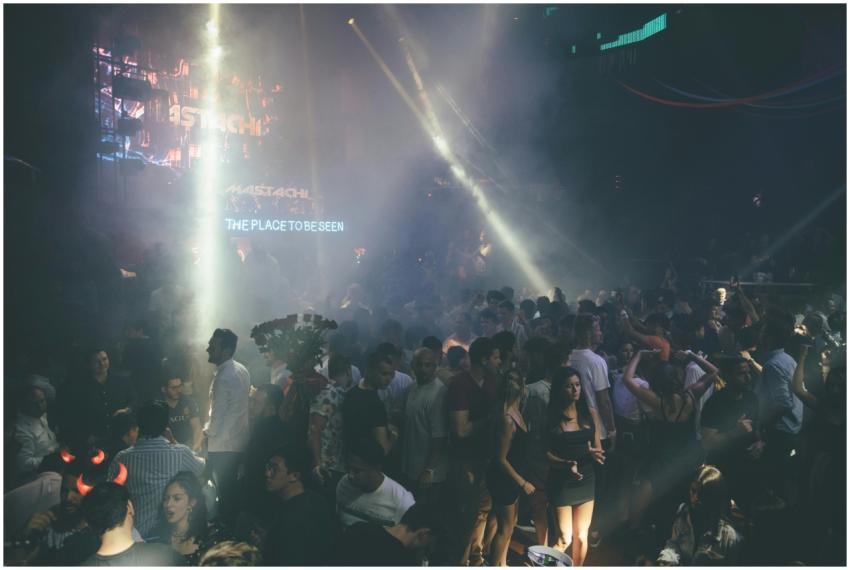 Exciting nightclub scene with a dancing crowd, vib